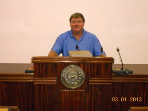 Dennis sitting in Legislature seat